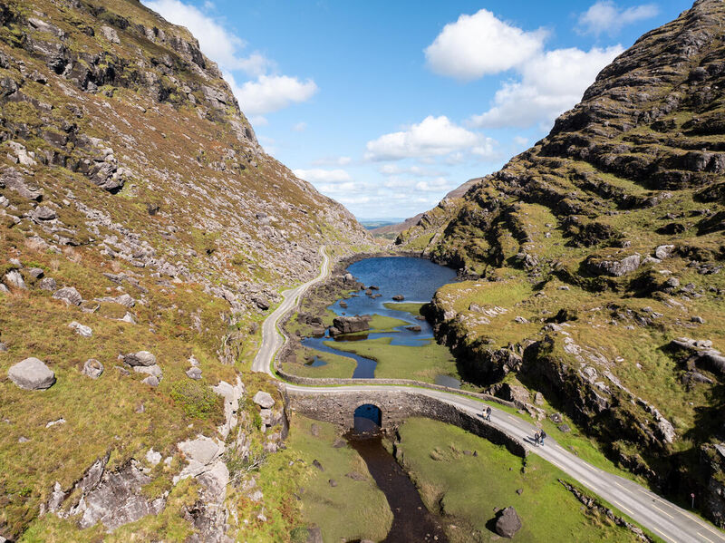 Walkers on the Kerry Way above the coast